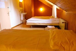 Letto o letti in una camera di Hôtel - Petit-déjeuner Le Trift