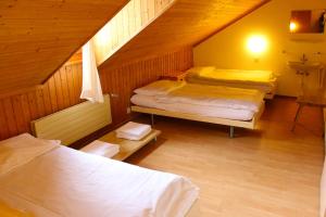Letto o letti in una camera di Hôtel - Petit-déjeuner Le Trift