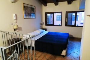 A bed or beds in a room at Cortile dei Sogni