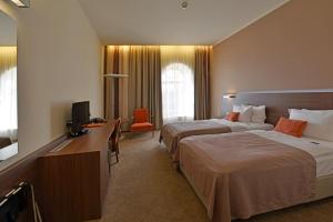 Postelja oz. postelje v sobi nastanitve Hotel Budweis
