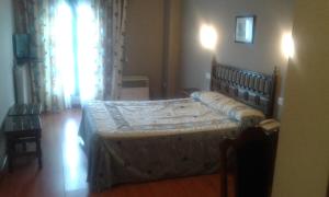 Postel nebo postele na pokoji v ubytování Hotel Casa Aurelia