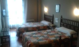 Postel nebo postele na pokoji v ubytování Hotel Casa Aurelia