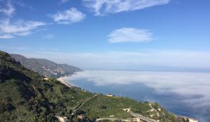 a view of the ocean from a mountain at B&B La Terrazza Sul Mare Taormina in Taormina
