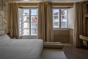 Postel nebo postele na pokoji v ubytování Hotel Atalaia