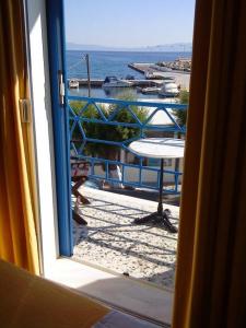 a view of the ocean from a window at Kythereia Hotel in Agia Pelagia