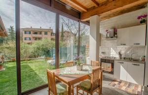 a kitchen and dining room with a table and chairs at Casale Pratoterra in Bracciano