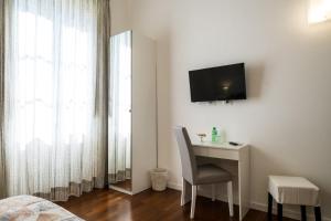 TV a/nebo společenská místnost v ubytování Ai Lattarini House