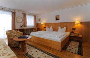 Postel nebo postele na pokoji v ubytování Stoll's Hotel Alpina