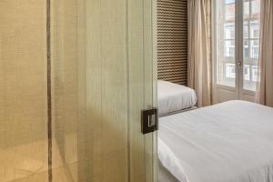Postel nebo postele na pokoji v ubytování Hotel Atalaia
