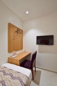 Postel nebo postele na pokoji v ubytování Hotel Leafio-Near Airport