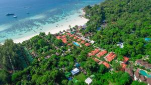 an aerial view of a beach with houses and trees at Sita Beach Resort in Ko Lipe