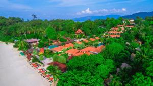 an aerial view of a resort with a beach and trees at Sita Beach Resort in Ko Lipe
