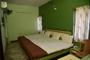 מיטה או מיטות בחדר ב-Hotel Chela