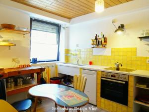 Kuchyň nebo kuchyňský kout v ubytování Lehmgefühl, Design Vier, La Petite Maison