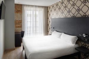 Postel nebo postele na pokoji v ubytování Hotel Atalaia