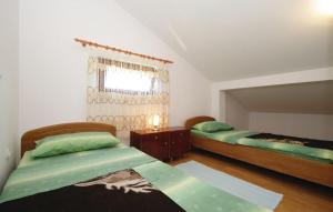 En eller flere senge i et værelse på Apartment Mirjana - EV friendly