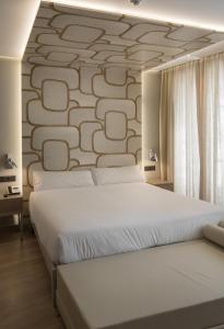 Postel nebo postele na pokoji v ubytování Hotel Atalaia