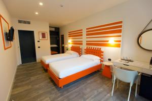 Postel nebo postele na pokoji v ubytování Hotel Al Campanile - Luxury Suites & Apartments