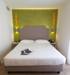 Postel nebo postele na pokoji v ubytování Hotel Al Campanile - Luxury Suites & Apartments