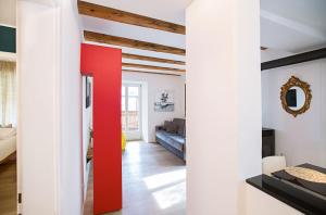 A bed or beds in a room at Ulivo Suites - apartments
