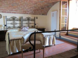 En eller flere senge i et værelse på Poggio delle Rondini
