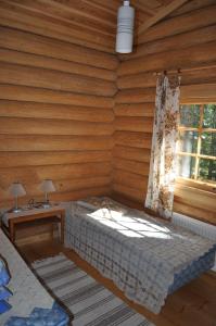 Postel nebo postele na pokoji v ubytování Hevossilta