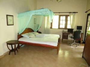 En eller flere senger på et rom på Hantana Forest Reserve Inn