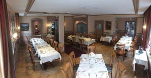 an overhead view of a restaurant with tables and chairs at Logis Hôtel Restaurant Au Cerf d'Or in Strasbourg
