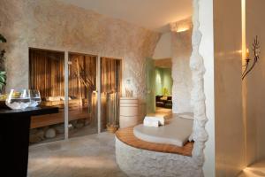 a bathroom with a bath tub in a room at House of Time - Fancy Suites in Vienna