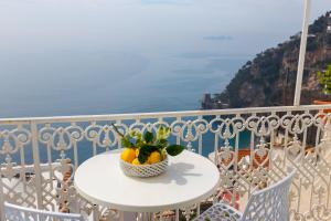 a white bowl sitting on top of a wooden table at Casa Nilde in Positano