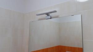 a shower with a mirror and a shower head at Savonaamare in Savona +62 photos