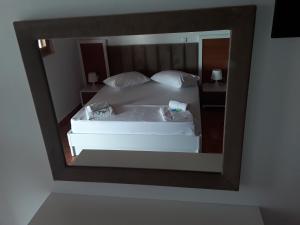 Voodi või voodid majutusasutuse Hotel Riviera toas