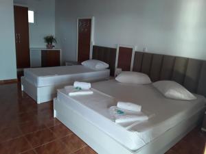 Voodi või voodid majutusasutuse Hotel Riviera toas