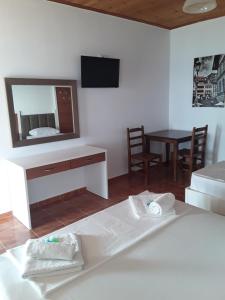 TV a/nebo společenská místnost v ubytování Hotel Riviera