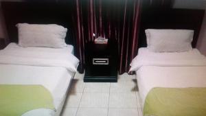 Ліжко або ліжка в номері Sahari Palace-Dammam