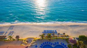 an aerial view of a beach and the ocean at GR Solaris Cancun All Inclusive in Cancún