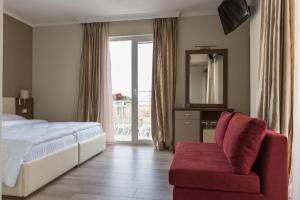 Postel nebo postele na pokoji v ubytování KEIT Hotel