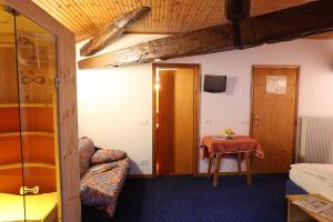 TV a/nebo společenská místnost v ubytování Albergo Due Spade