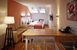 Postel nebo postele na pokoji v ubytování Rudolfo Hotel