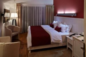Postel nebo postele na pokoji v ubytování Rudolfo Hotel