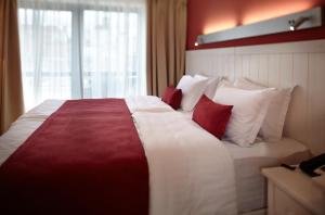 Postel nebo postele na pokoji v ubytování Rudolfo Hotel