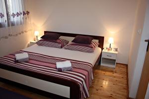 Postel nebo postele na pokoji v ubytování Apartment Ana