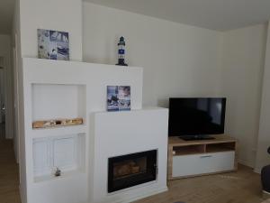 TV a/nebo společenská místnost v ubytování Hafenzauber