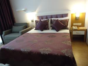 Postel nebo postele na pokoji v ubytování Bilkay Hotel