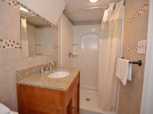 a bathroom with a sink and a shower at Shore Beach Houses - 111 Lincoln Ave in Seaside Heights