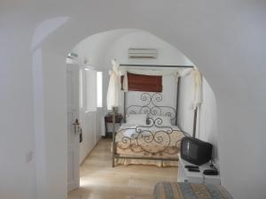 Postel nebo postele na pokoji v ubytování Nomikos Villas
