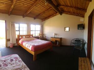 En eller flere senge i et værelse på Barnyard Backpackers Te Anau