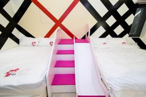 Кровать или кровати в номере Ai Lian Shan Shui Homestay