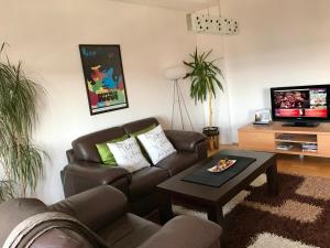 a living room with a couch and a coffee table at Orion Apartment 1 in Prishtinë