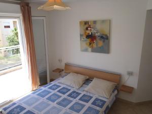 Postel nebo postele na pokoji v ubytování Appartement Les Alizés + 37 fotografií